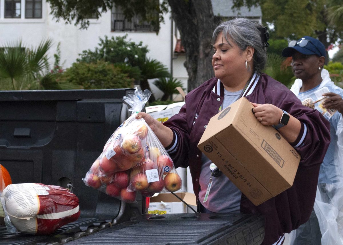 Volunteers load food donations from the San Antonio Food Bank into a truck during a Pop-Up Market at SAC. Photo by Ariana Silvas.