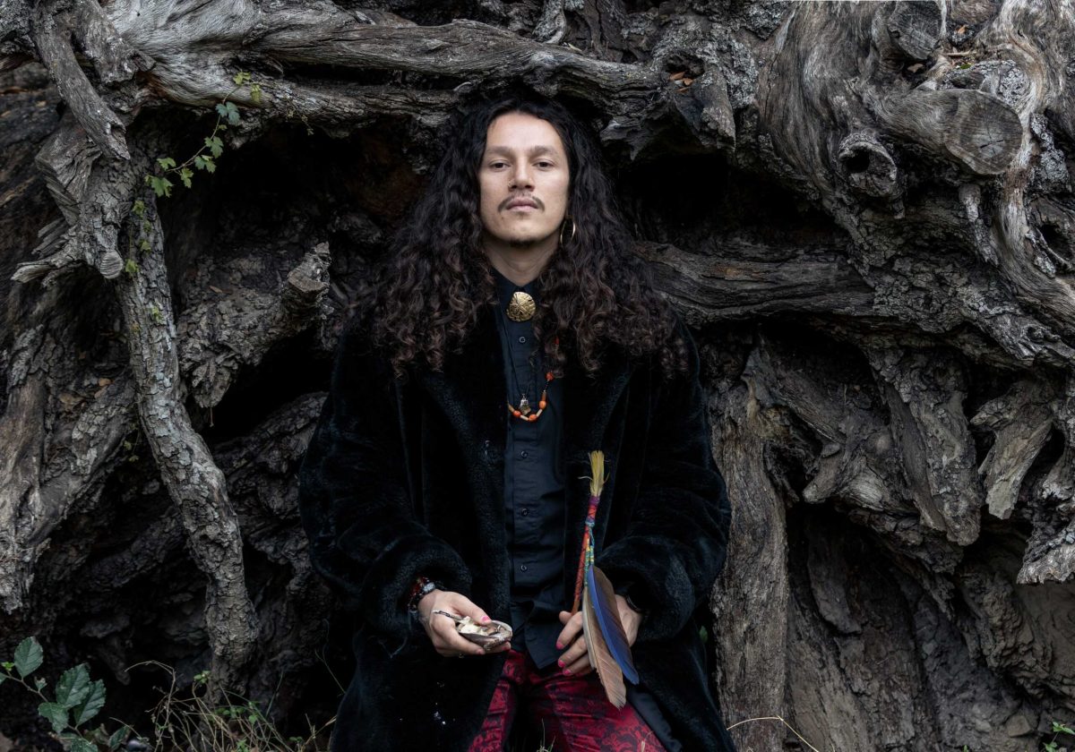 As a San Antonia native, Ānua Reyes was born in the area their ancestors called Yanaguana, or Land of the Spirit Waters. They visited San Pedro Springs Park Dec. 14, praying and appreciating the area they say is the sacred land of their people. Photo by Agustin De Leon.