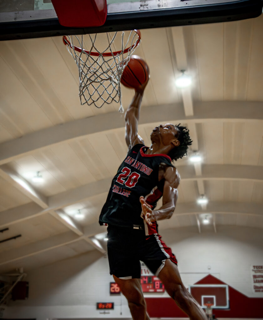 Caleb Richardson #20 dunking. Photo by A. De Leon