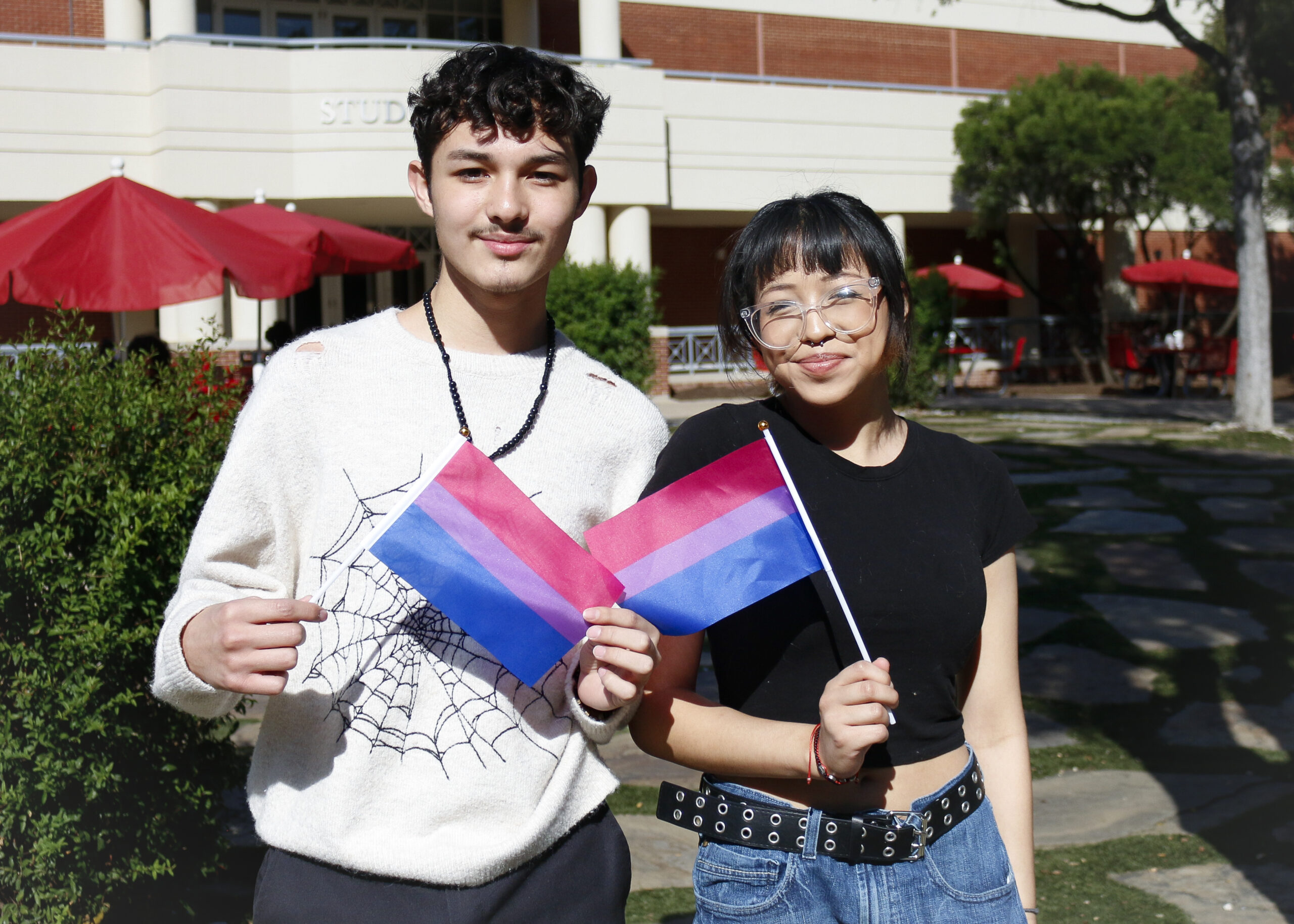 Business Administration student Alex Gonzalez and Biology student Mia Ceballos proudly flew Bisexual Flags at SAC’s National Coming Out Day celebration Oct. 10. Photo by D.J. Agleton