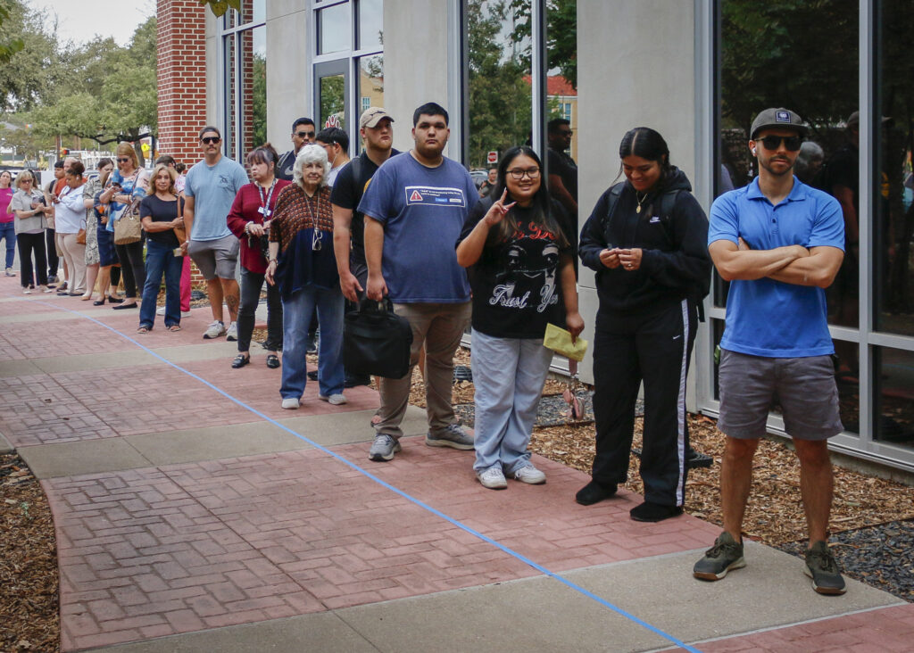 Bexar County residents line up outside San Antonio College’s Victory Center Tuesday to cast their votes in the 2024 general election. Photo by D.J. Agleton.