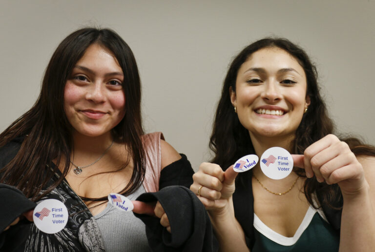 Freshman Pre-nursing students Alexandria Camarillo (left) and Brynn Fonseca show off their voter stickers while posing for a picture after voting in the 2024 general election at SAC's Victory Center Tuesday. Photo by D.J. Agleton.