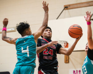 Armadillos guard Demetrice Mims fights for a contested layup at the Abraham Kazen Middle School Gym Oct. 9. Photo by A. De Leon.