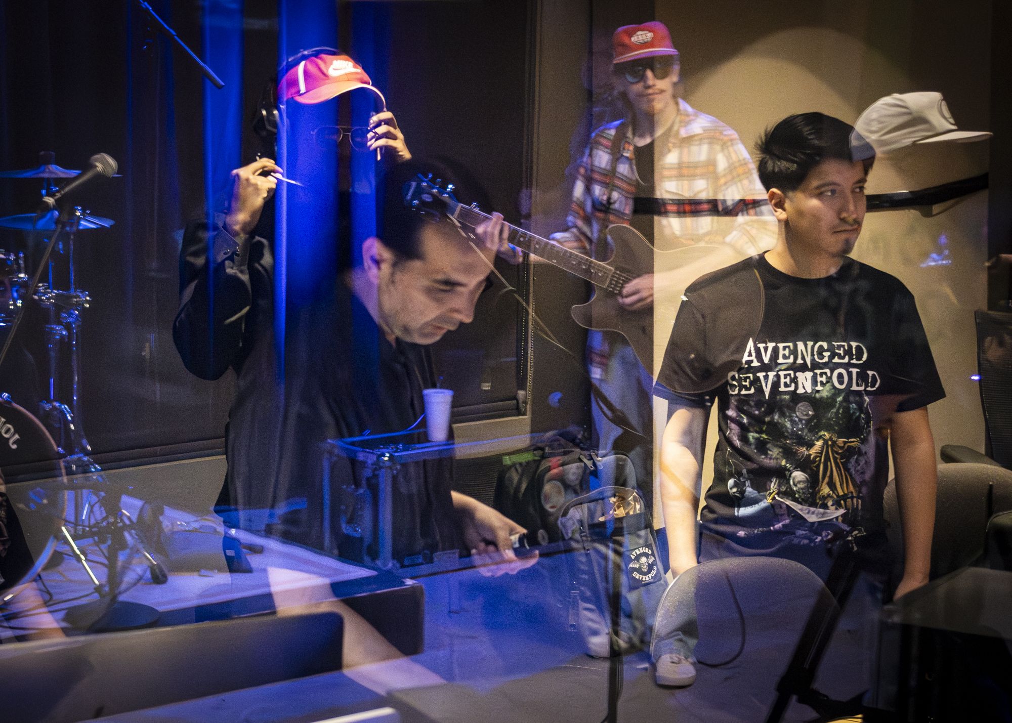 Dr. Ruben C. Rodriguez, assistant professor in SAC’s Music Business program, guides students and adjusts audio levels in Studio B of the Radio Television, and Film building Oct. 15. Photo by Pablo Viveros.