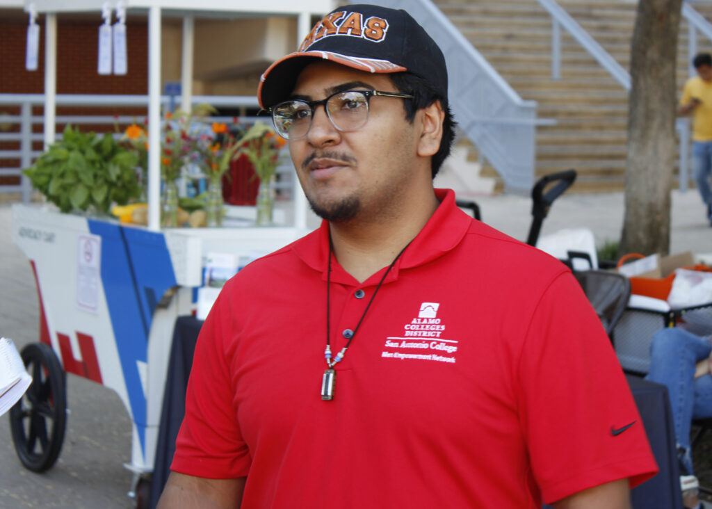 Nathan Sauceda, president of the San Antonio College Men Empowerment Network (SACMEN), spoke to students while raising funds for the club at the Antojitos Festival in the mall area Sept. 25. Photo by Pablo Viveros