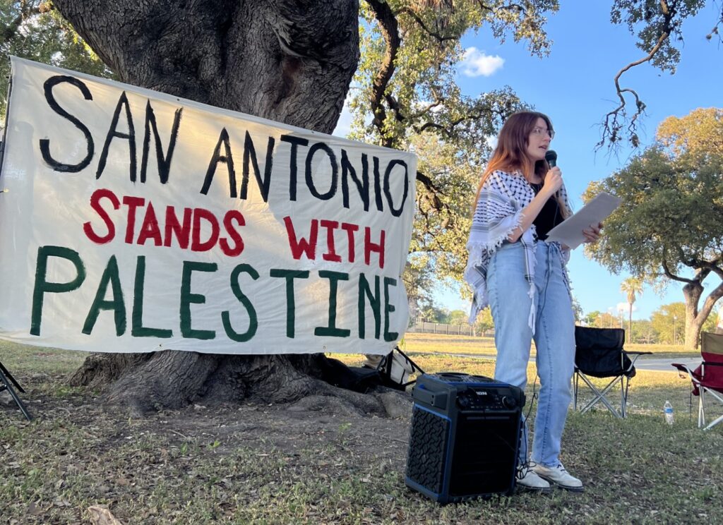 English Instructor Fatima Masoud, how is Palestinian-American, reads "If I Must Die" by Refaat Al-Areer, a Gazan poet, at San Pedro Springs Park Oct. 6. Photo courtesy of Fatima Masoud.