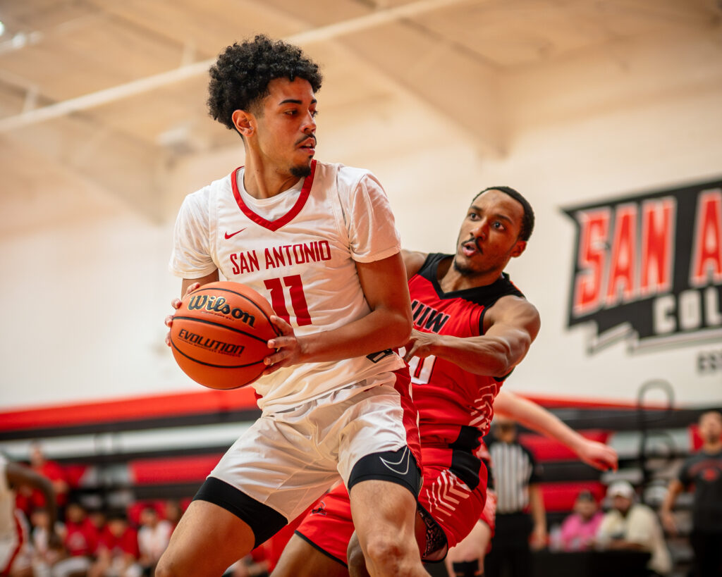 SAC Center Markus Salinas battles a UIW defender in the post at the Candler Physical Education Center Nov. 6. Photo by A. De Leon.