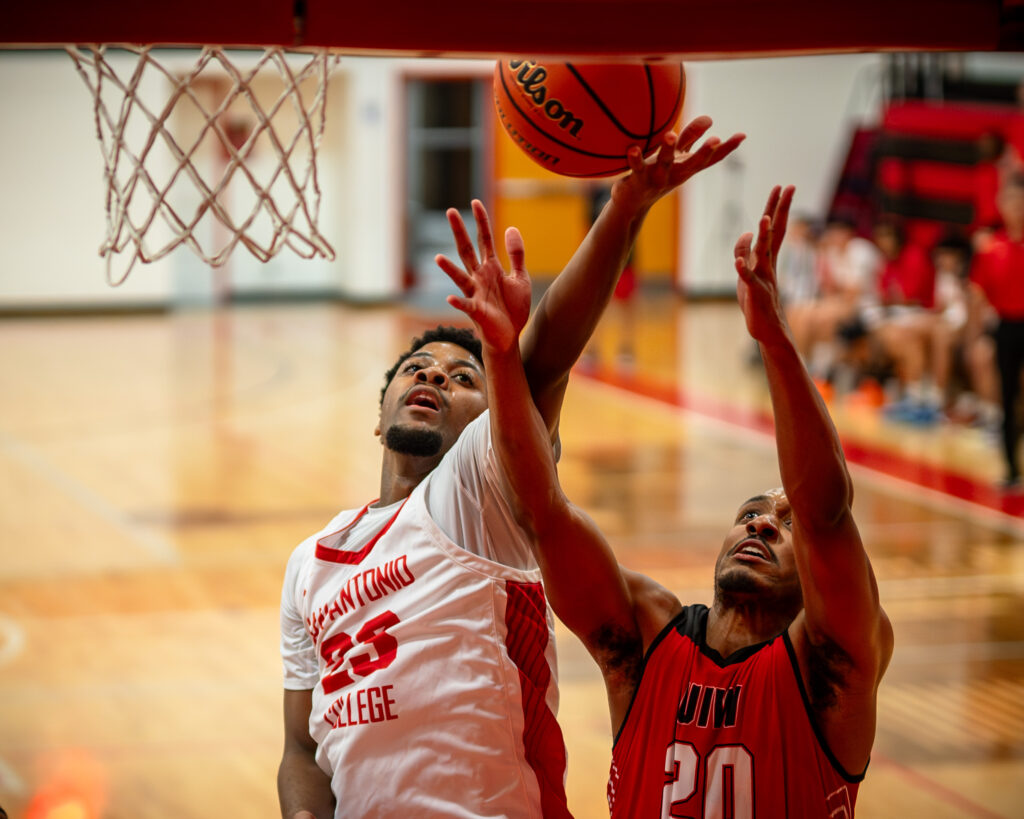 SAC Forward Malachi Jenkins jumps for a layup past a UIW defender at the Candler Physical Education Center Nov. 6. Photo by A. De Leon.