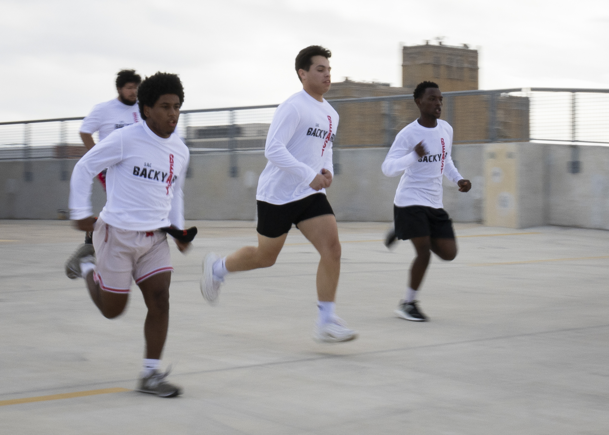 A men’s team takes off from the starting line in the Backyard Beast Team Fitness Challenge at Parking Garage 3 Nov. 1. Photo by Vivian Mora.