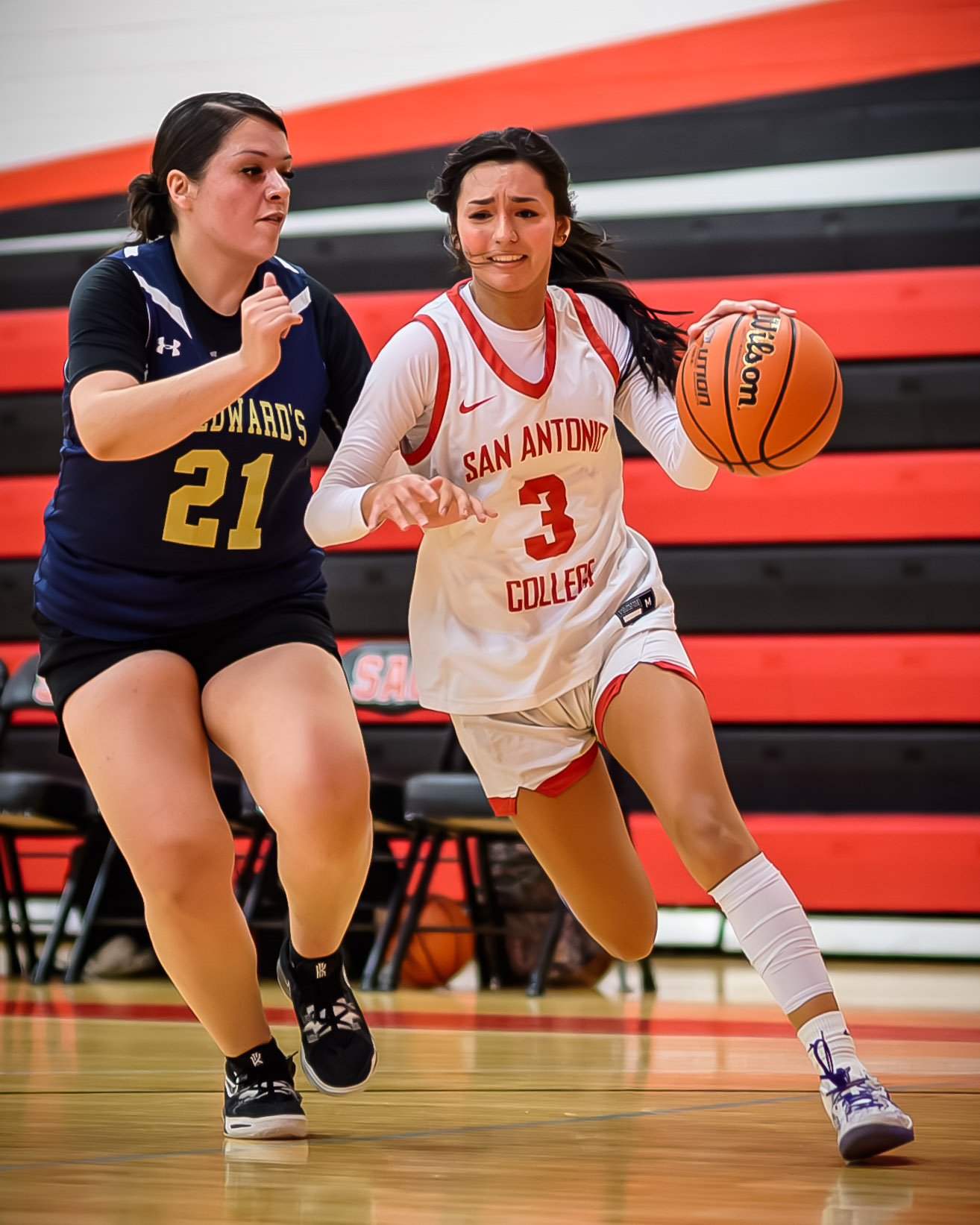 SAC's Alexis Castillo drives past an SEU defender at the Candler Physical Education Center Oct. 30. Photo by A. De Leon.