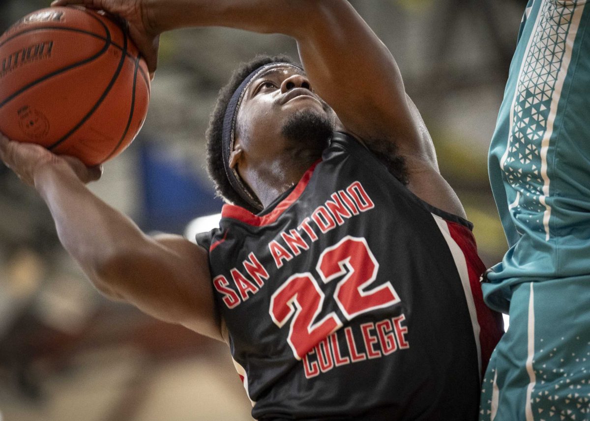 SAC’s Reggie Steadman controls the ball in the post during the Texas Collegiate Athletic Conference championship game at Northeast Lakeview College Sunday. Photo by A. De Leon.