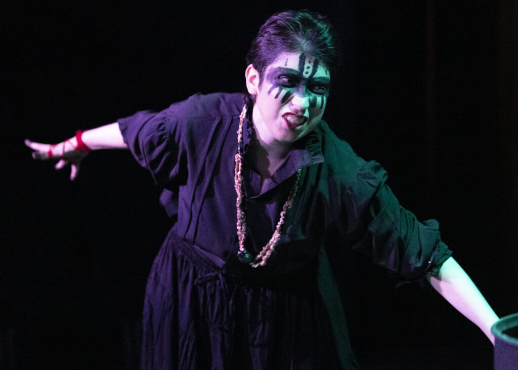 Elizabeth Potts, as one of the three brujas (Spanish for witches) in SAC’s production of a Narcos-inspired Macbeth. Photo by Janelle Alemán.