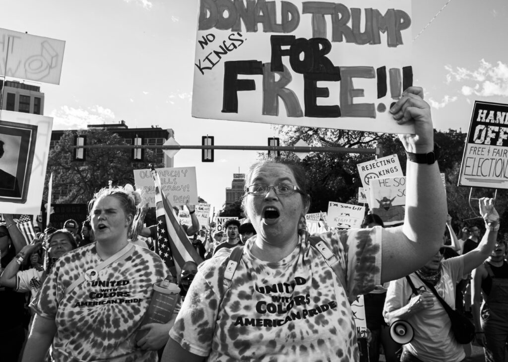 A protester chants and marches along Market Street at the “No Kings” protest Saturday. Photo by Jacob R. Lopez.