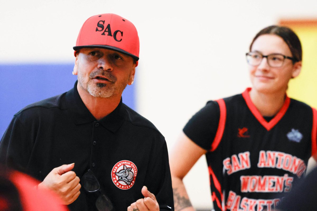Head Coach Abel Castillo talks to his players during a timeout. Photo by Janelle Alemán.