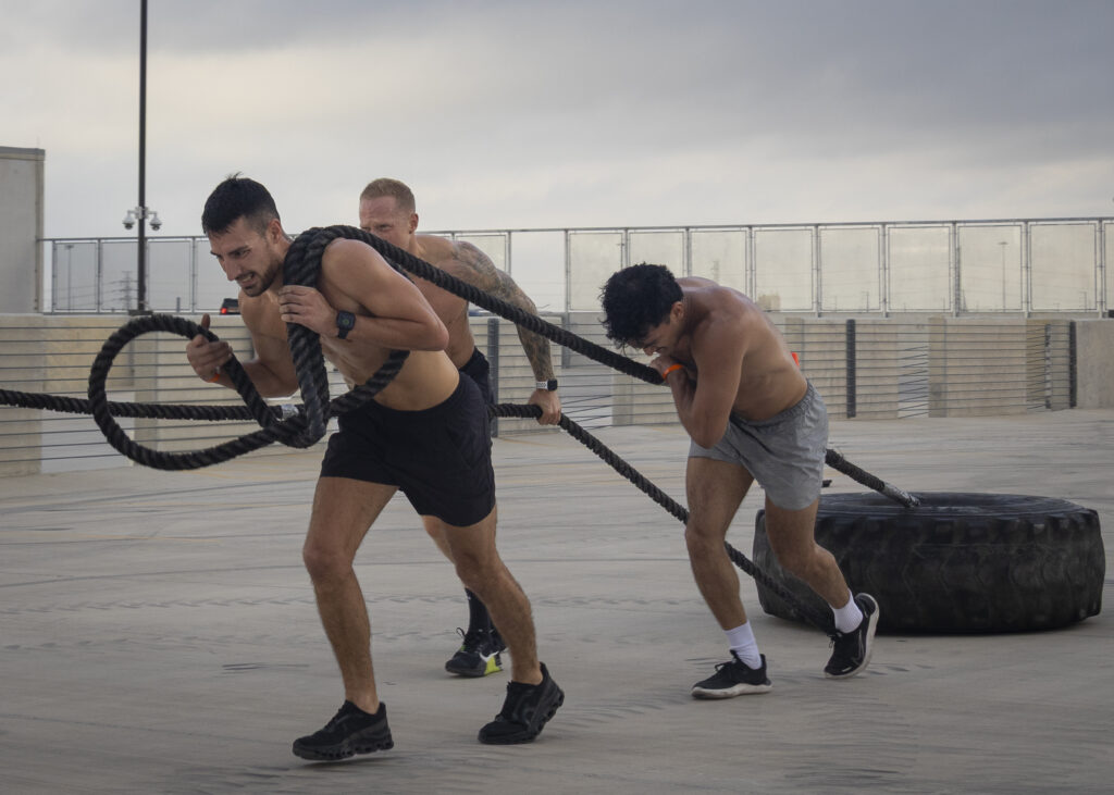 Athletes strain against the tire pull at Backyard Beast Oct. 24 Photo by Blake White.