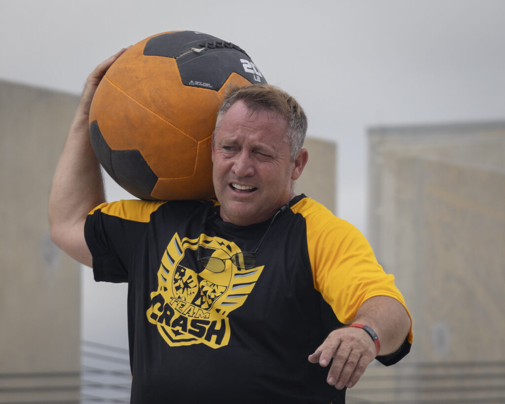 A competitor carries a medicine ball at Backyard Beast Oct. 24. Photo by Blake White.