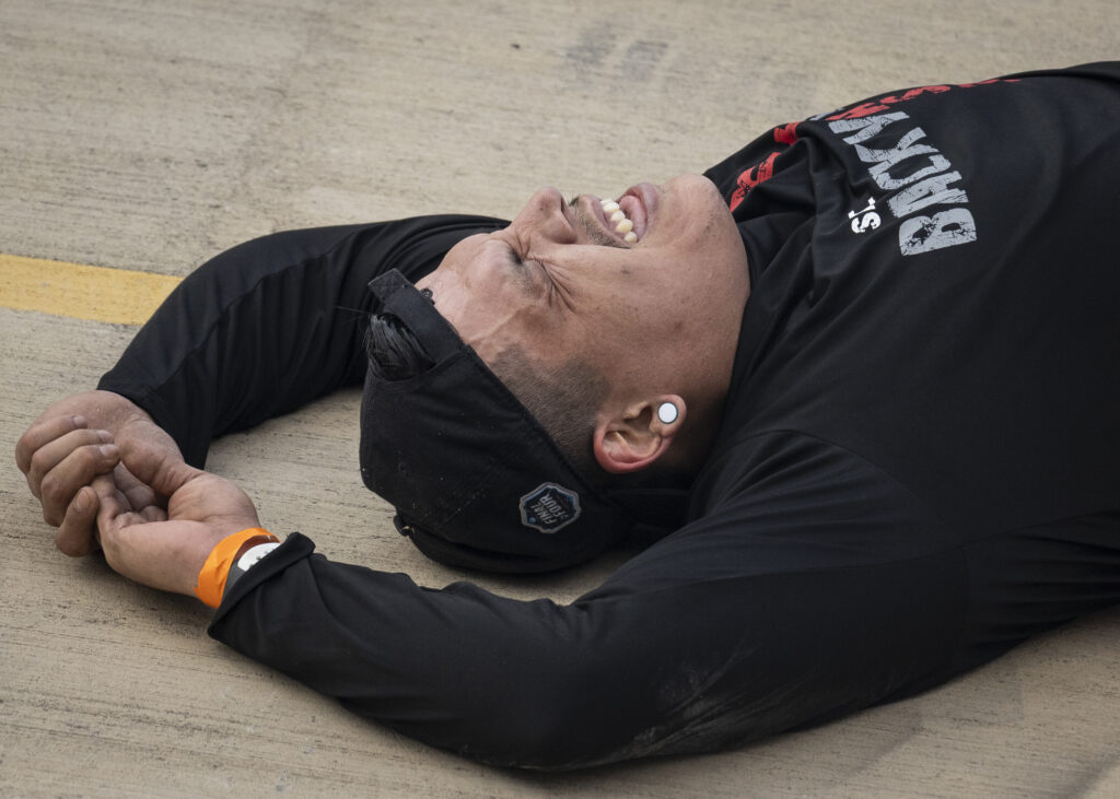 A competitor lies exhausted after completing the Backyard Beast competition Oct. 24. Photo by Blake White.