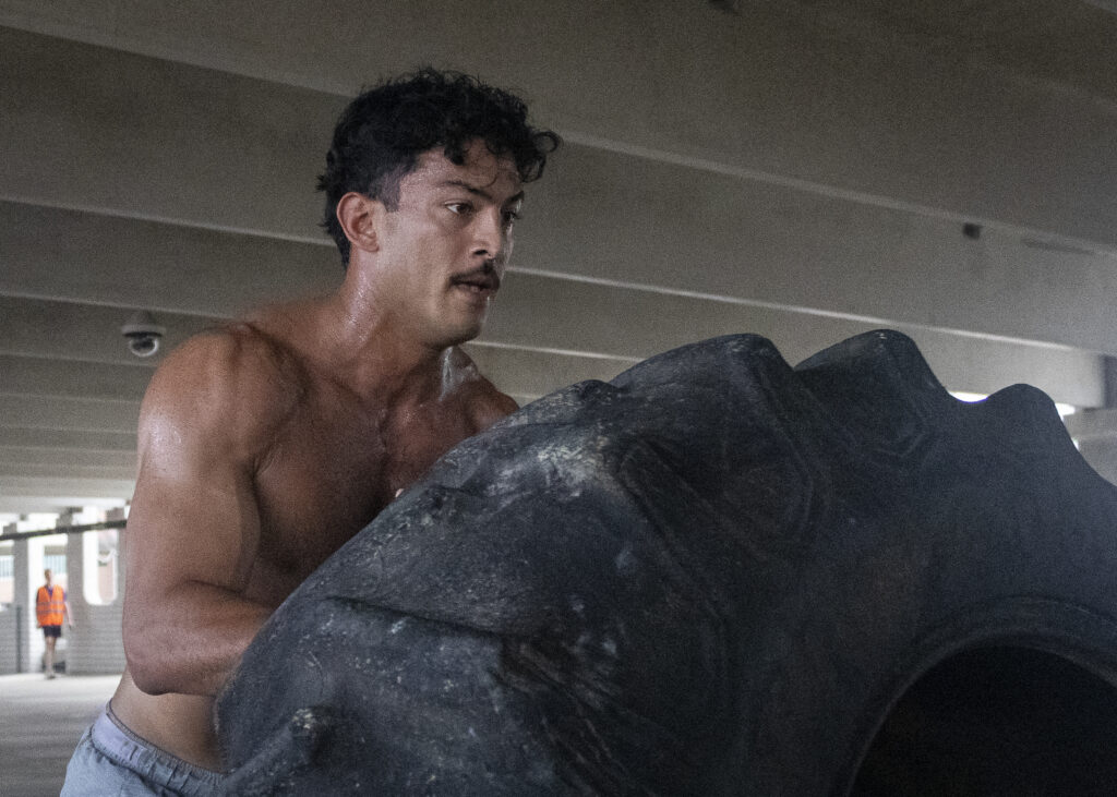 A member of Team OTF flips a tire during the Backyard Beast competition Oct. 24. Photo by Chris Hernandez.