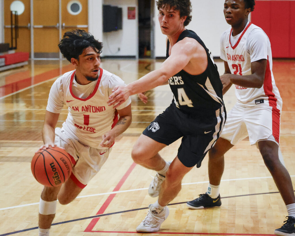 SAC Point Guard Aidan Planas drives to the hoop against Trinity Wednesday. Photo by Thomas Solis.