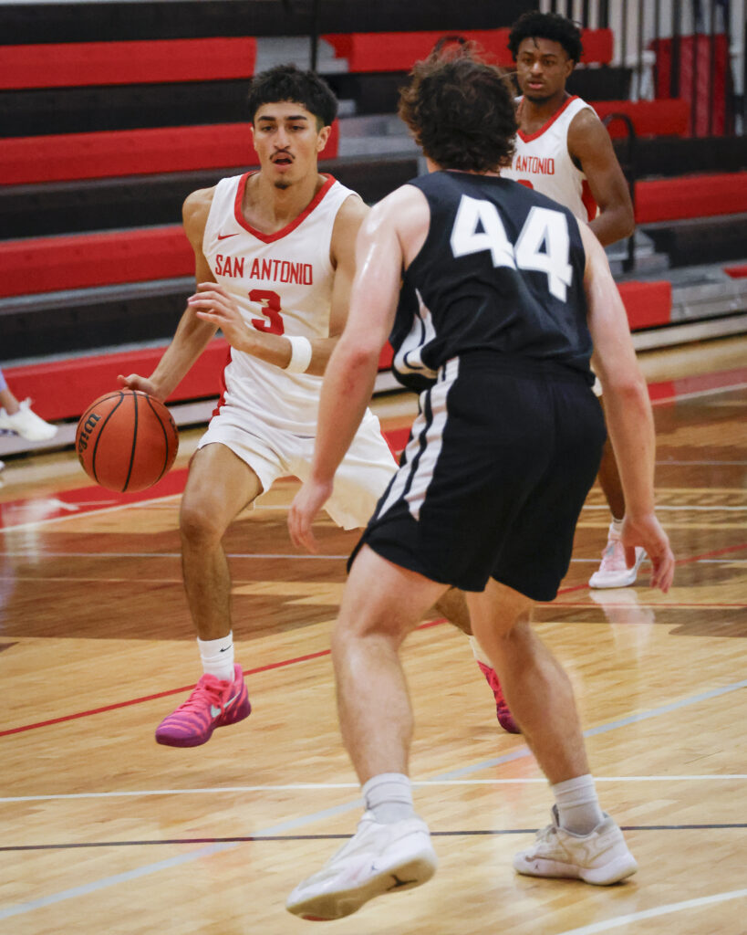 SAC Guard Dominic Guerra drives the ball against Trinity’s Tigers at SAC’s Chandler Physical Education Center Wednesday. Photo by Thomas Solis.