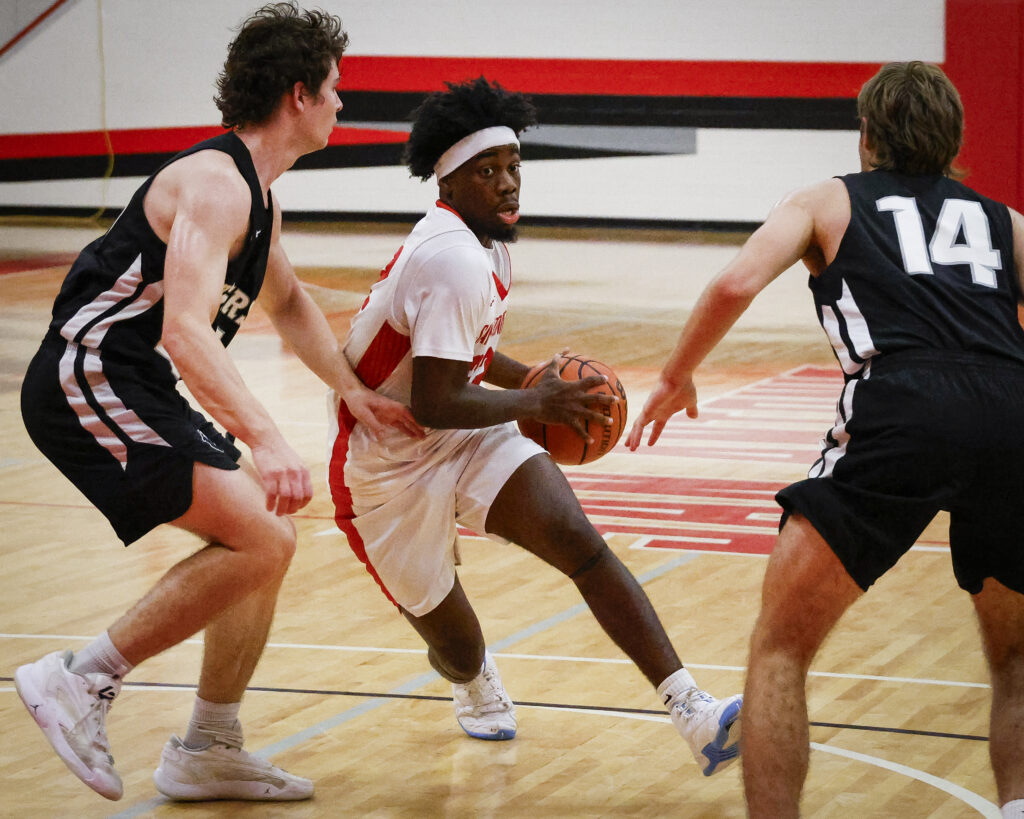 SAC Guard Reginald Steadman soars past Trinity’s defense at SAC’s Chandler Physical Education Center Wednesday. Photo by Thomas Solis.