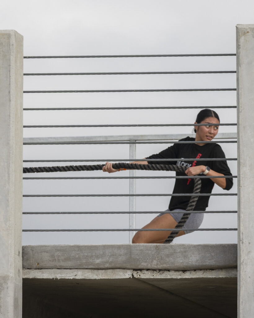 A competitor looks over her shoulder as she pulls a tire at Backyard Beast Oct. 24. Photo by Vanessa Wiggins.