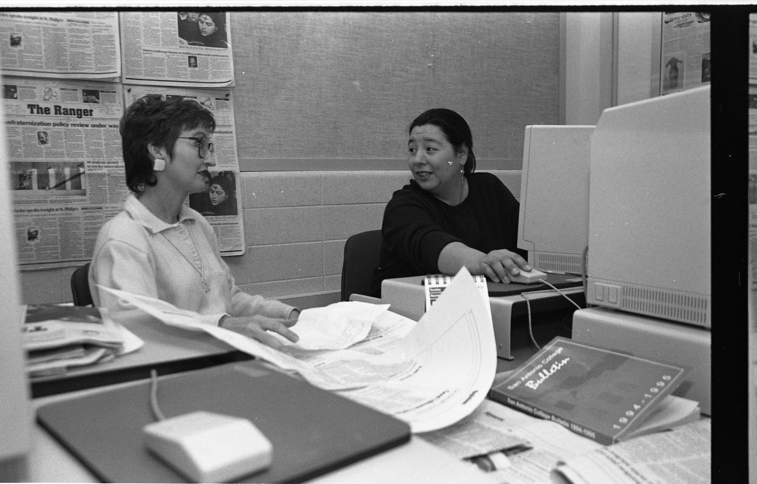 Ranger Advisor Marianne Odom, left, and fellow advisor Irene Abrego, discuss story content in the Ranger newsroom. Archive photo.
