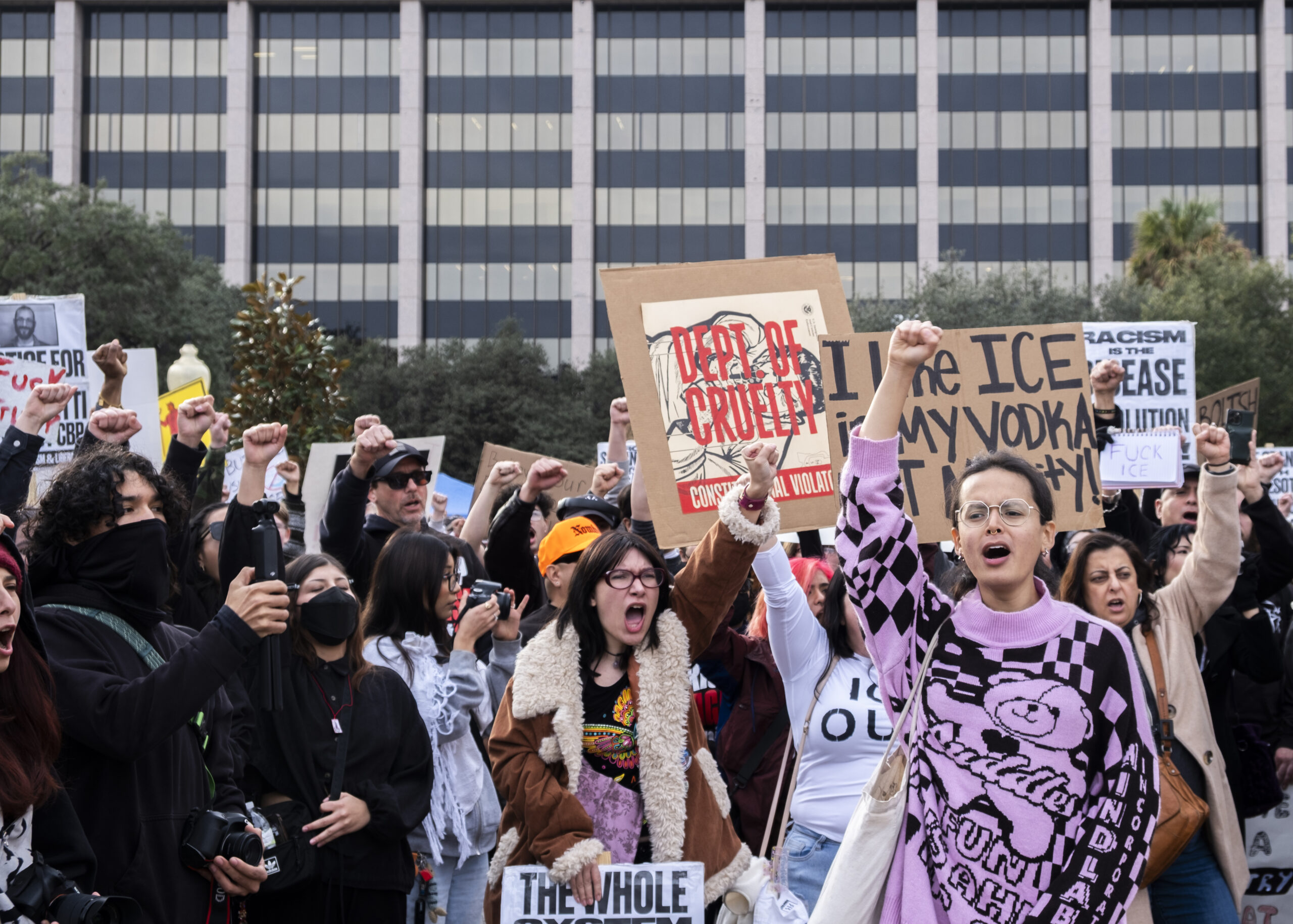 Hundreds of protesters raise there fists in the air in during the ICE Out protest Friday. Photo by Jacob R. Lopez.