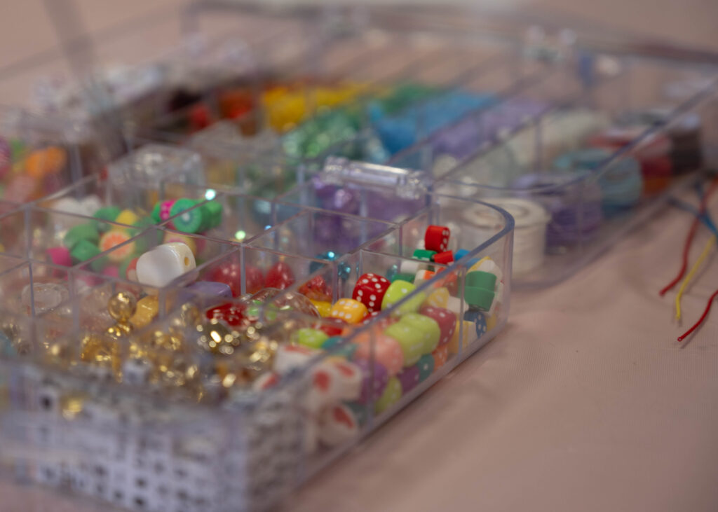 Trays of beads laid out for students to make bracelets with at the Valentine Creation event to support survivors of human trafficking in the Loftin Student Center Feb 12. Photo by Catie Broadus.