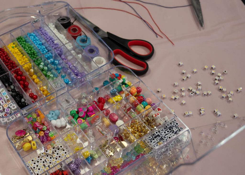 Trays of beads and supplies laid out for students to make bracelets with at the Valentine Creation event to support survivors of human trafficking in the Loftin Student Center Feb 12. Photo by Catie Broadus.