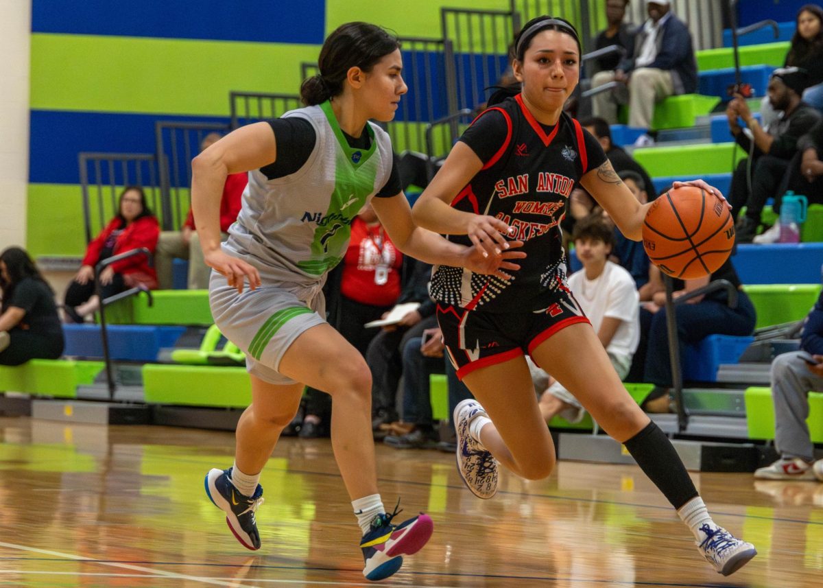 SAC Guard Alexis Castillo drives to the basket leaving behind one of the top players of the Nighthawks on at Llano Wellness Center Feb.11. Photo by Christopher Hernandez.