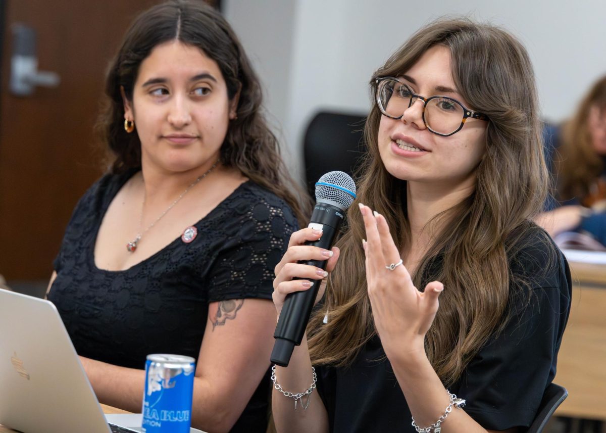 President Mia Smith and Secretary Emma Jansure Addressed questions regarding International students to Principal Designated School Official For international Student Affairs Patrice Ballard during the Student Government Association meeting on feb 13. Photo By Christopher Hernandez.