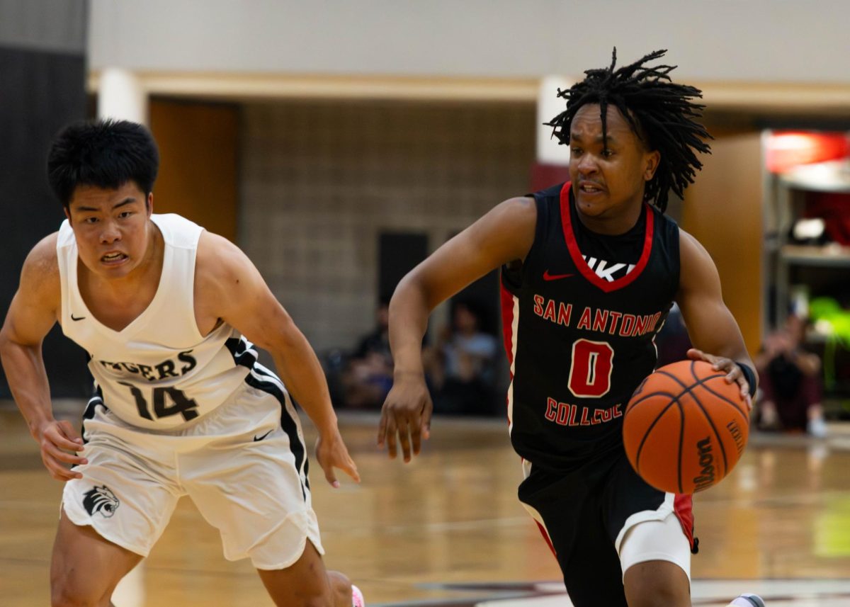 SAC Men's Armadillo forward James Ngare, passing the Tigers driving to the line for easy buckets Wednesday night at Trinity University Bell Athletic Center.