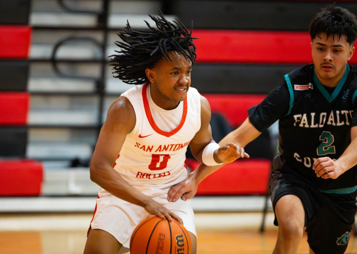 SAC small forward, James Ngare, controls the ball for a shot against Palo Alto College on Wednesday at the Candler Physical Education building. (Janelle Alemán)