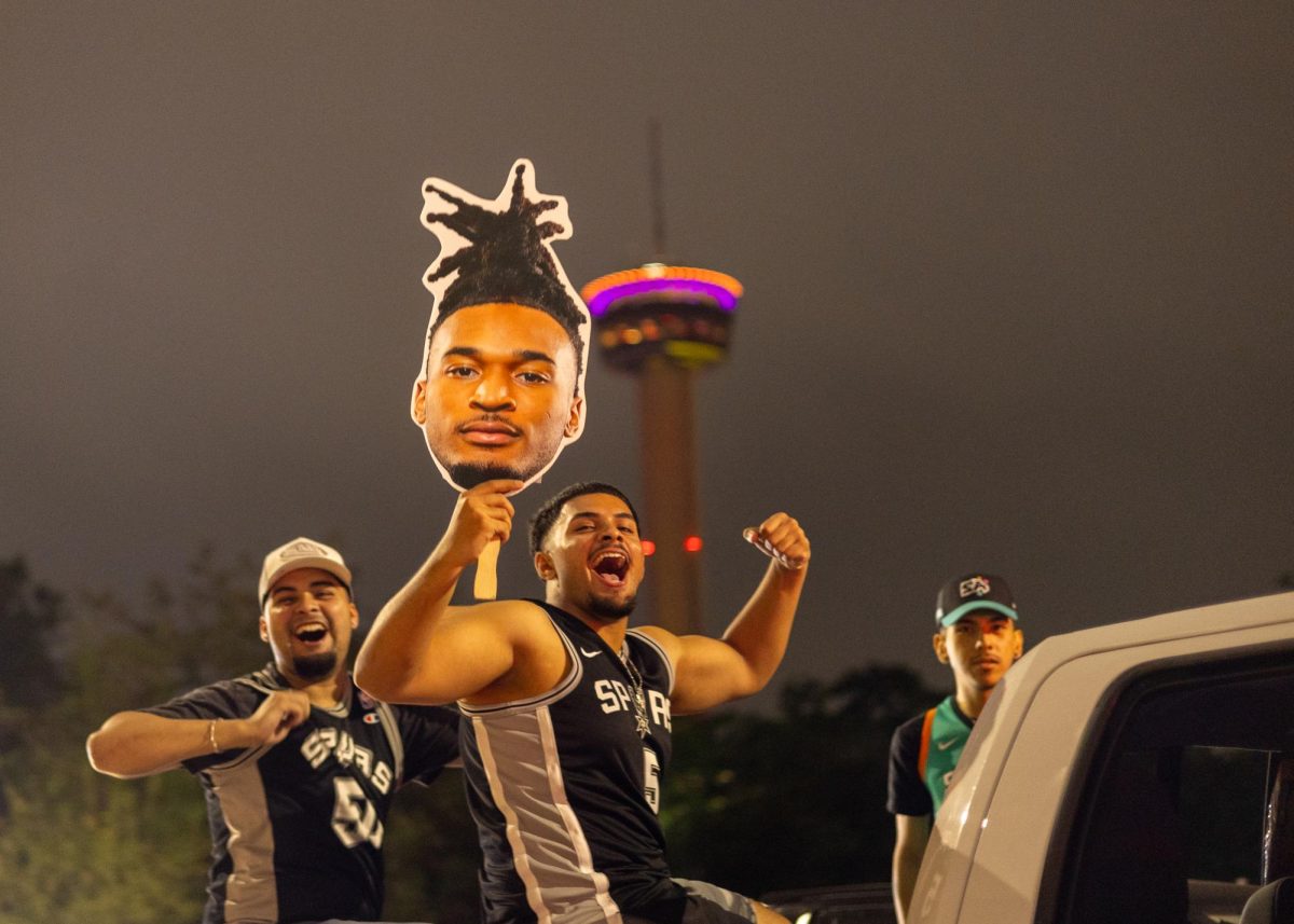 San Antonio Spurs fans join in a Spurs win tradition as they honk their horns downtown on Commerce St.