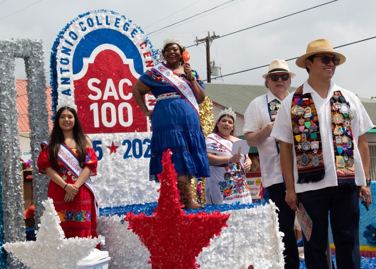 SAC Royal Crown Court Ambassador Salma Flores, Sovereign Ambassador Rayshanda 'Ray' Dawson and Monarch Destiny Garcia, along with SAC President Dr. Francisco Solis and his husband Jerry Solis ride on SAC's parade float during the 2026 Battle of Flowers parade Friday, April 24.