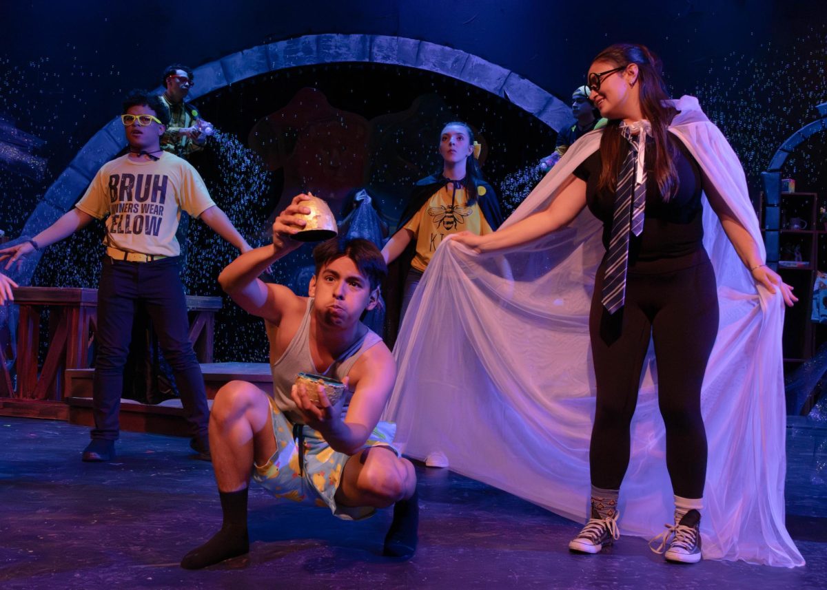 SAC drama club students Alexander Alemán as Cedric in "Puffs" opens a golden egg. The play will be at San Pedro Playhouse running April 23 to 26.