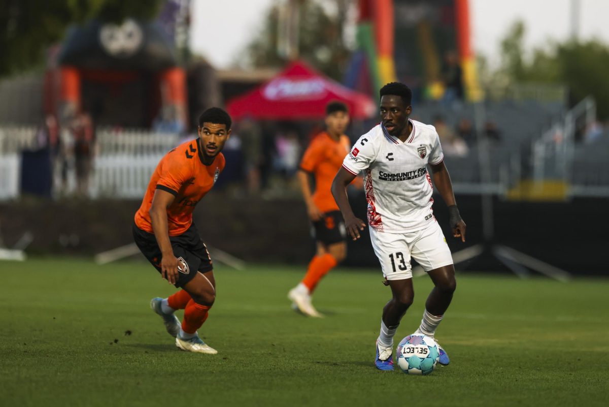 SAFC Defender Akeem O'Connor-Ward Challenges Orange County Striker Lyam MacKinnon During Wednesday Night's Match in Irvine, CA