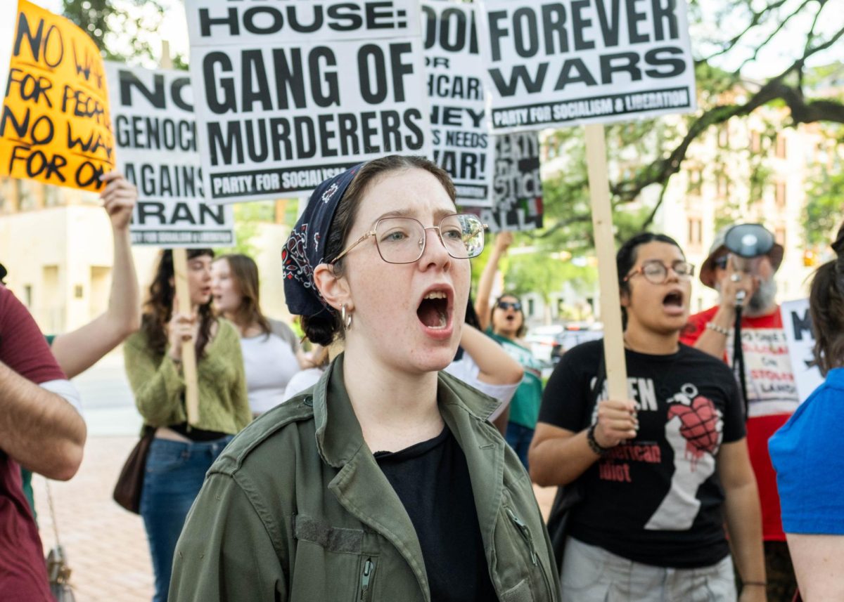 Protesters chant as speakers with the Party for Socialism and Liberation lead chants into the crowd on Wednesday.