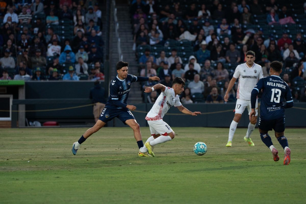 SAFC Forward Cristian Parano dribbling through traffic against El Paso Locomotive on Saturday night