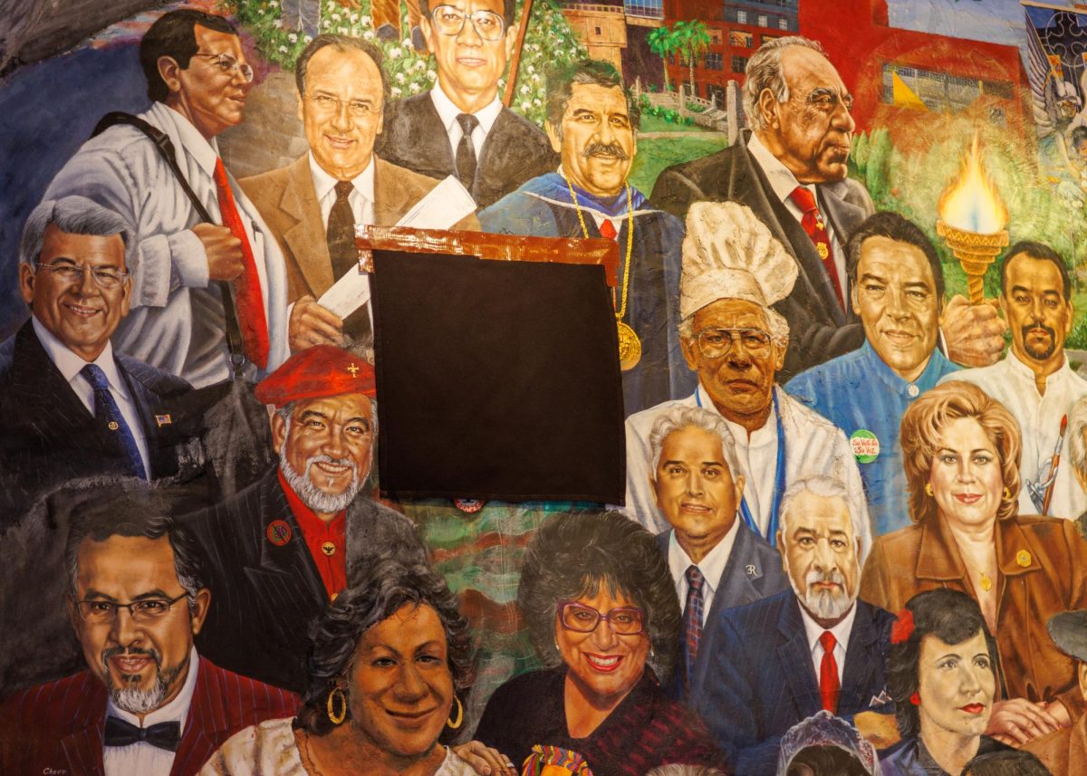 Black cloth napkins cover Cesar Chavez in the “Celebración a Mi Madre” mural inside Mi Tierra restaurant downtown San Antonio.