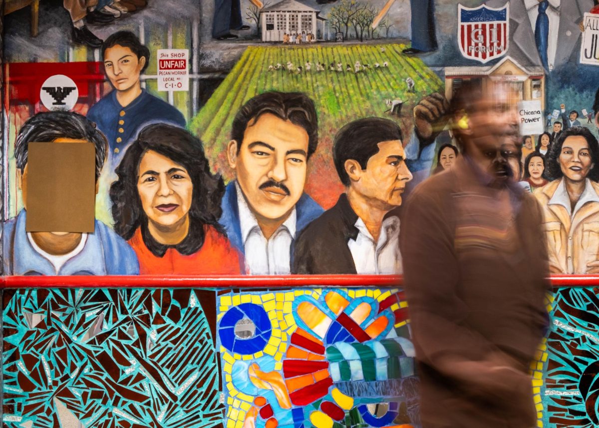 SAC student walks past the United Farm Workers mural in the Fiesta room, Wednesday April 15.