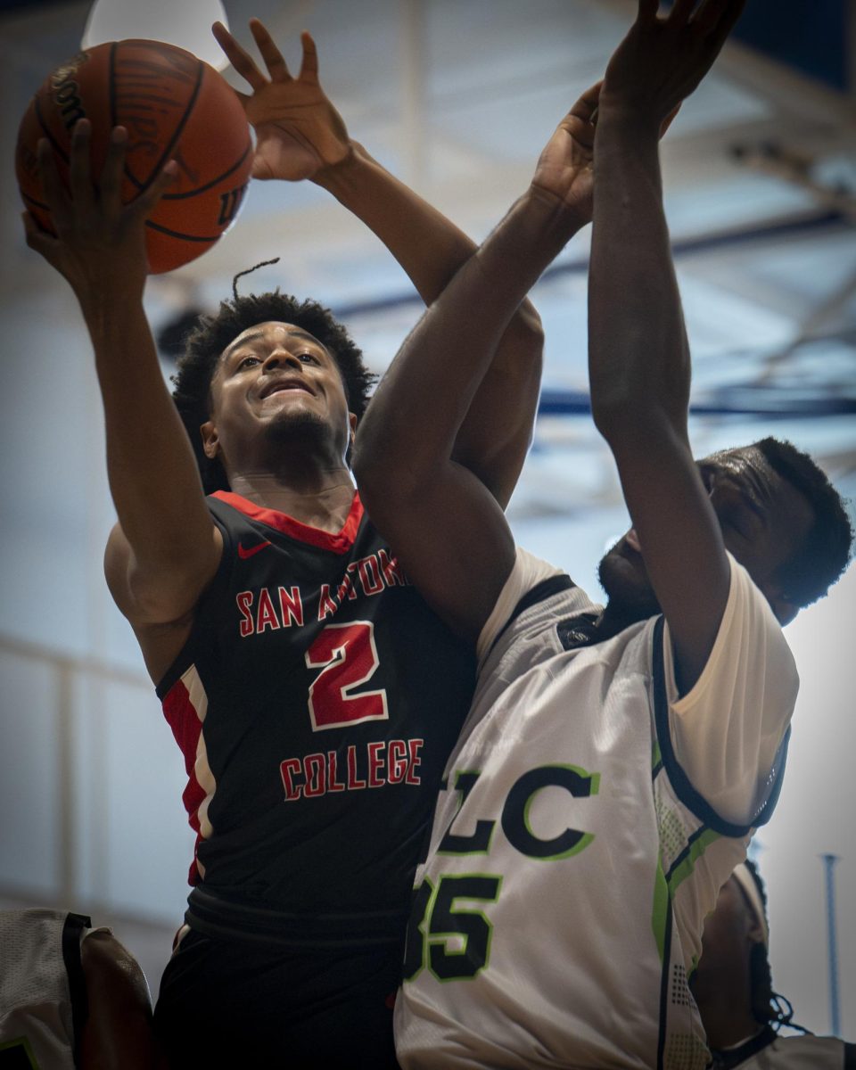 SAC shooting guard Kai Byrd reaches for a rebound Saturday during a semifinal game at St. Philip’s.