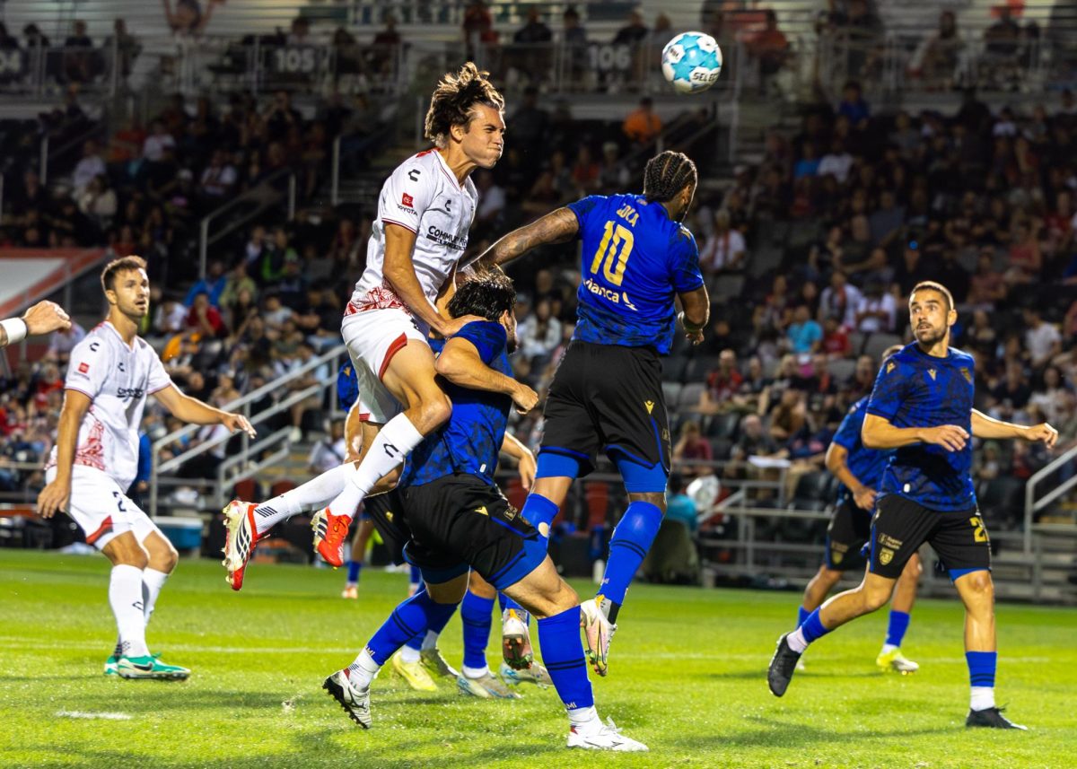 San Antonio Football Club Defender Tiago Suarez fights for a header inside the box Friday night at Toyota Field.