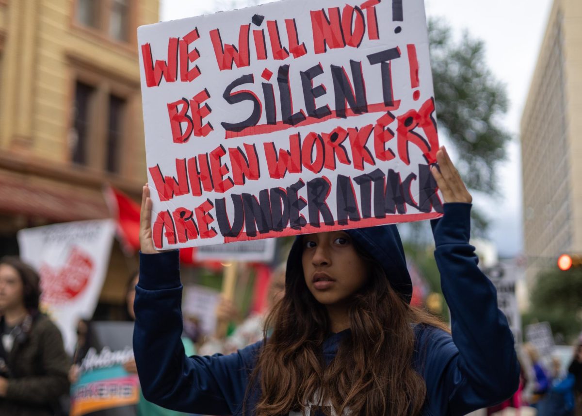 Demonstrators march to the Hipolito F. Garcia Federal Building and U.S. Courthouse for the San Antonio May Day rally on Friday, May 1.