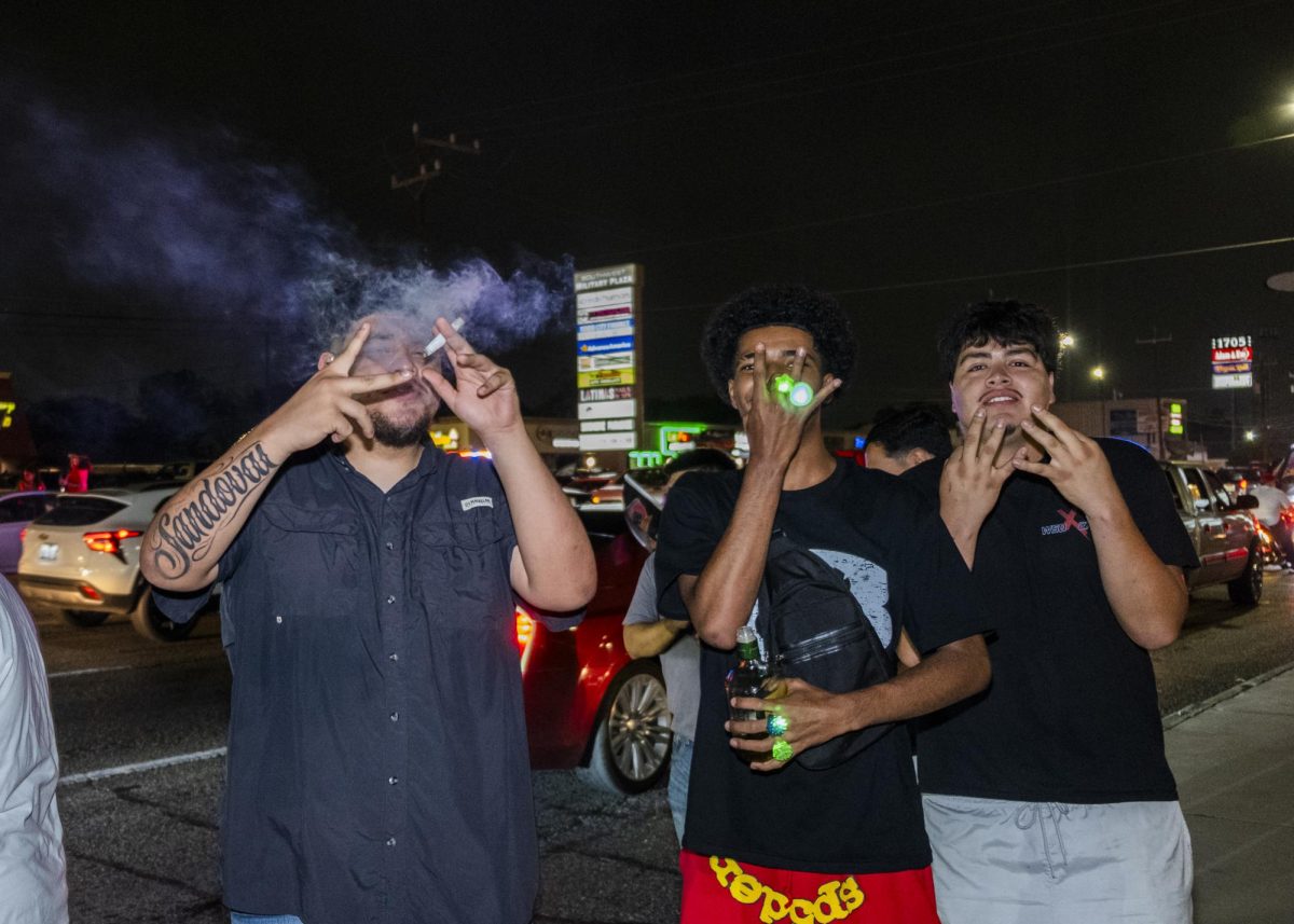 San Antonio Spurs fans gather on Southwest Military Drive, honking up and down the street after a historic Game 1 win on Monday. 