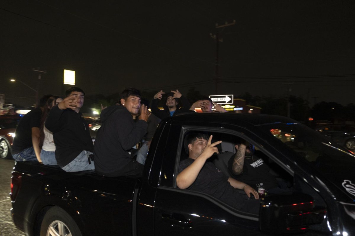 San Antonio Spurs fans gather on Southwest Military Drive, honking up and down the street after a historic Game 1 win on Monday. 