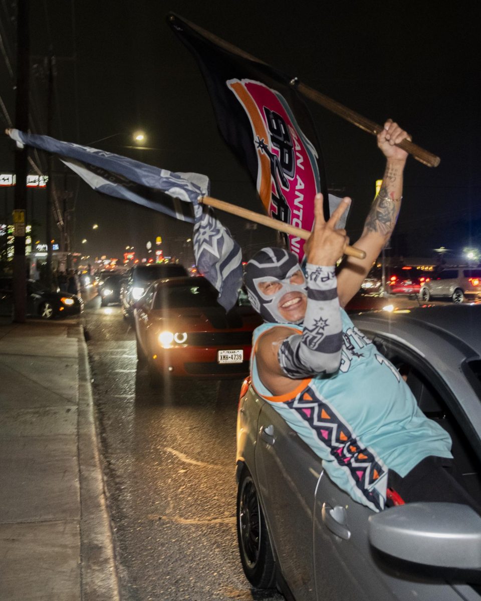 San Antonio Spurs fans gather on Southwest Military Drive, honking up and down the street after a historic Game 1 win on Monday. 