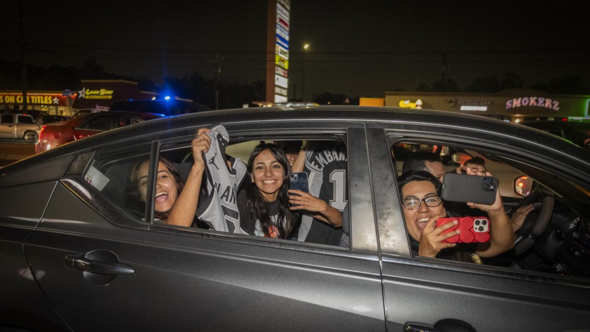San Antonio Spurs fans gather on Southwest Military Drive, honking up and down the street after a historic Game 1 win on Monday. 