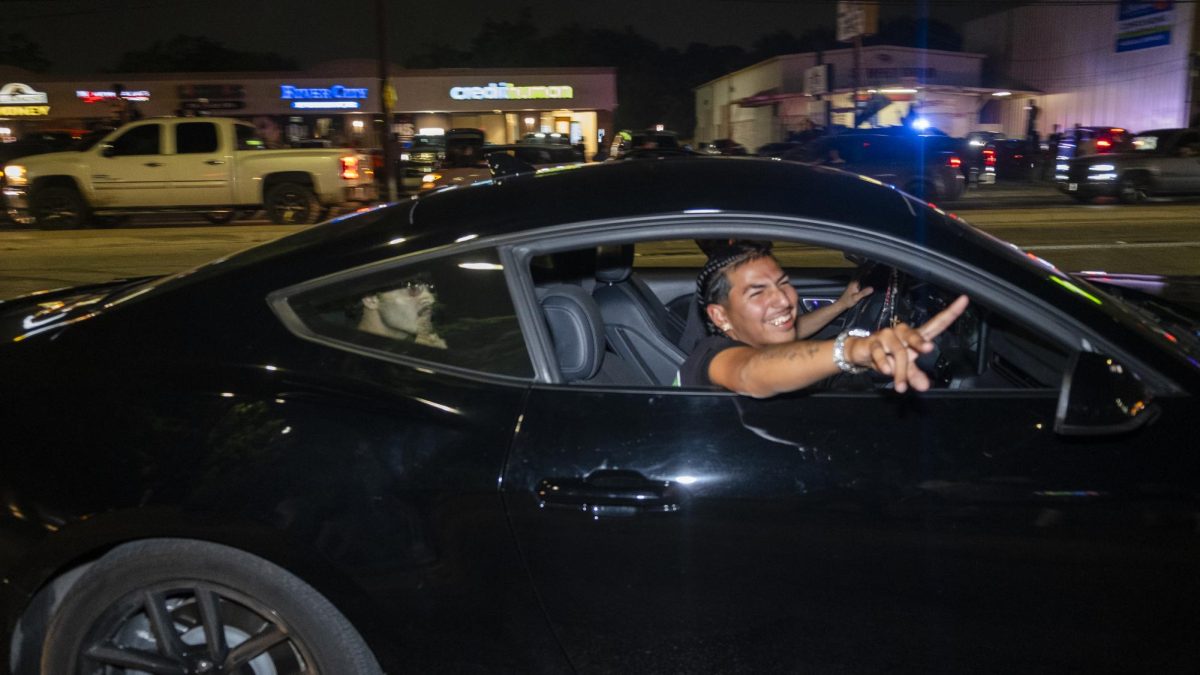 San Antonio Spurs fans gather on Southwest Military Drive, honking up and down the street after a historic Game 1 win on Monday. 